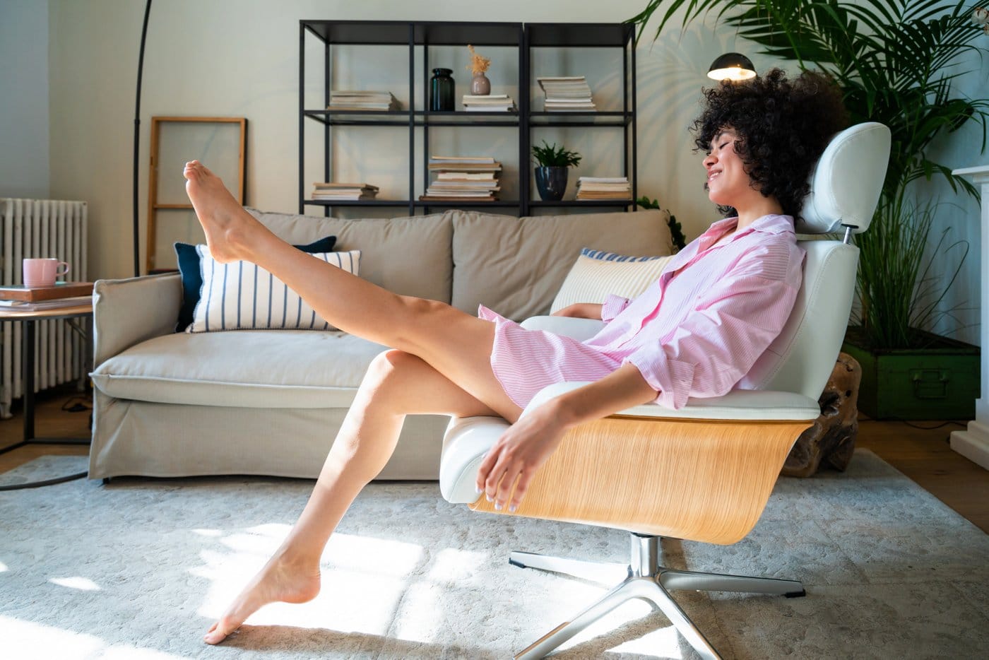 Woman alone at home sitting around in her pajamas