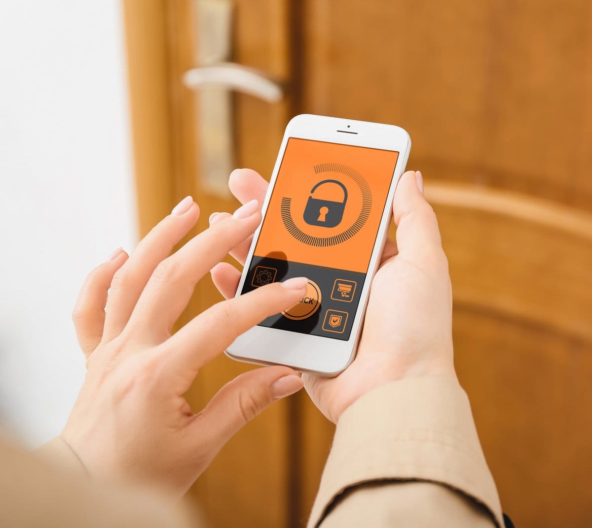 Woman using a phone a app to open a smart lock